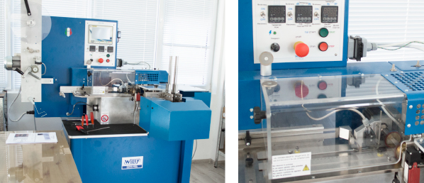Machine for cutting and folding fabric labels